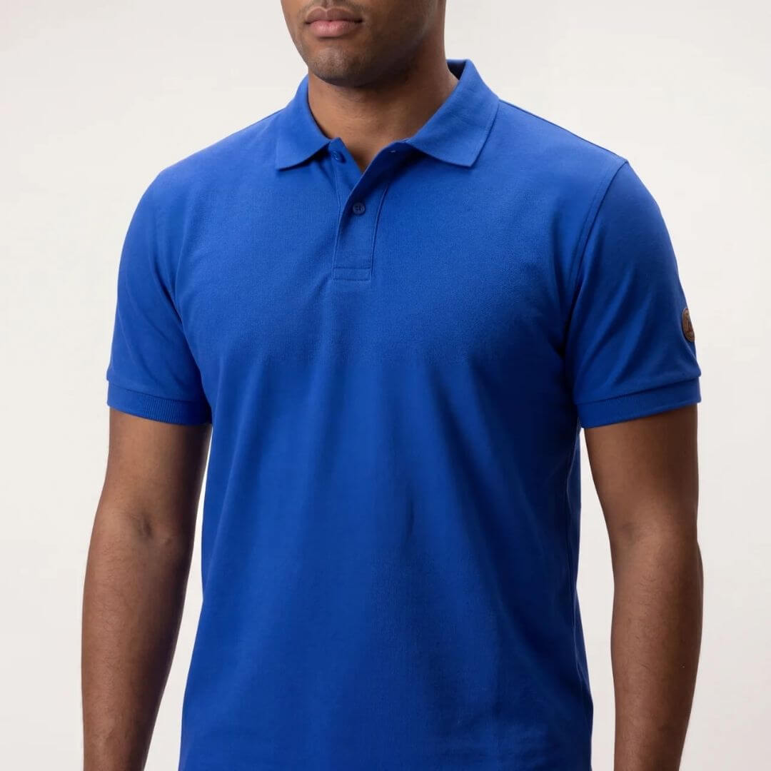 Adrenalina unisex polo majica v modri barvi s kratkimi rokavi, primerna za športne in prosti čas.